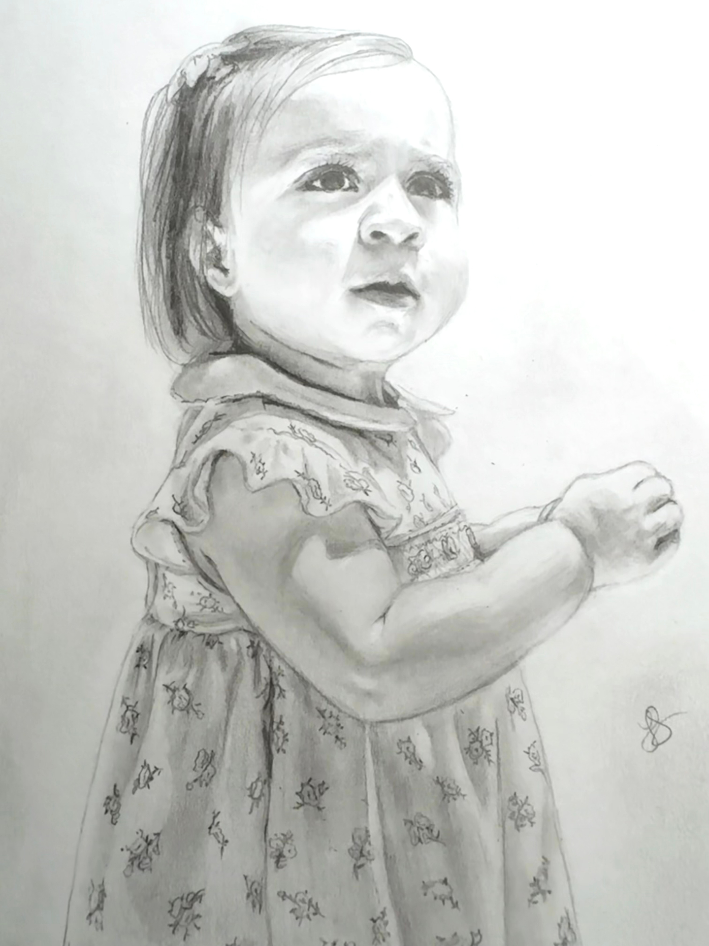Portrait of a young child in a floral dress