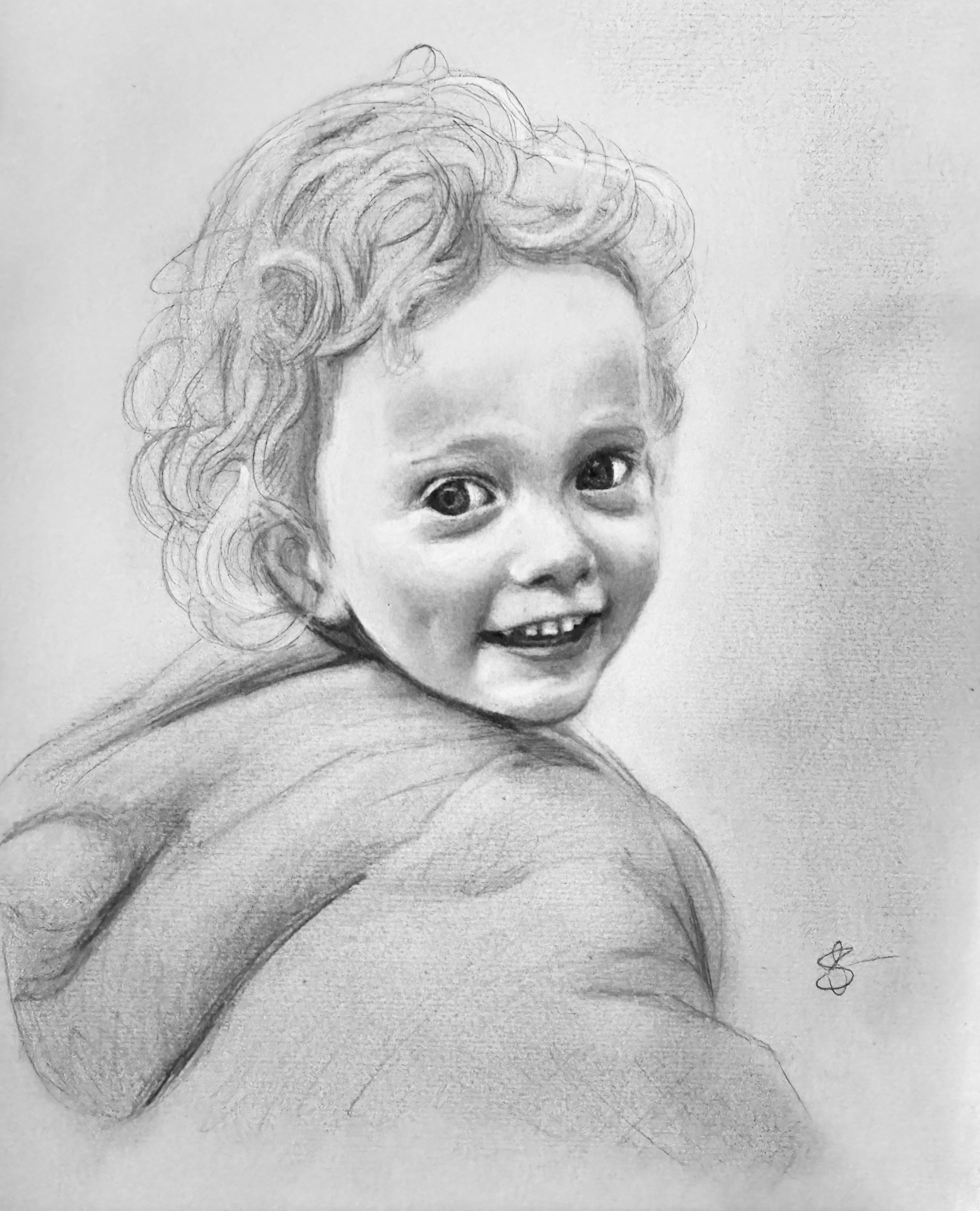 Happy Rey Rey — smiling curly-haired toddler